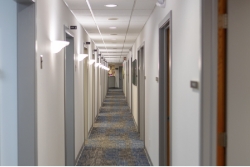 Hallway branching off into dental operatories