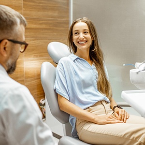 Lady smiles at dentist