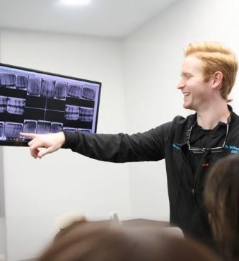 Dentist showing a patient an x ray of their teeth