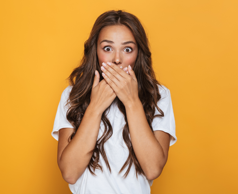 Woman covering mouth