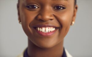 smiling young woman with a gap between her teeth